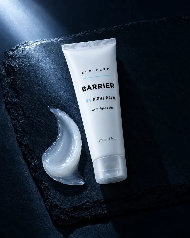 The Night Balm beside a swipe of the clear balm