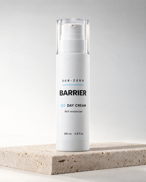 BARRIER Day Cream fragrance-free moisturizer in a 200 ml white airless bottle by Sub-Zero, on travertine in studio light