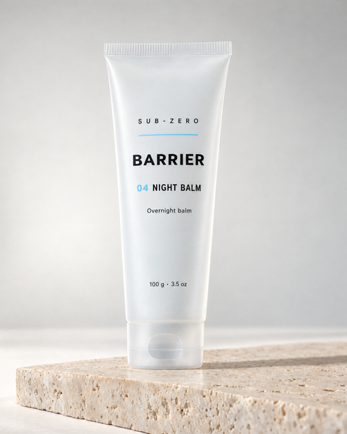 BARRIER Night Balm fragrance-free overnight balm in a 100 g frosted tube by Sub-Zero, on travertine in studio light
